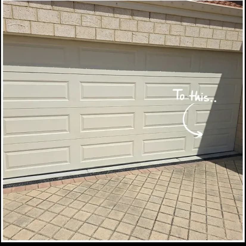 The same sectional garage door closed straight and square in its opening